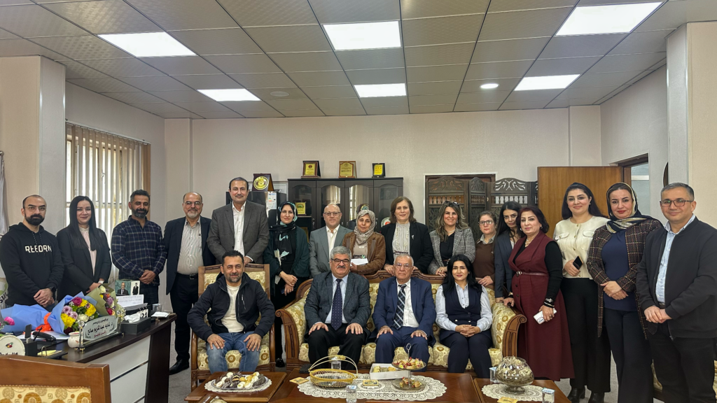 The College of Veterinary Medicine staff with my uncle, my sister, and me